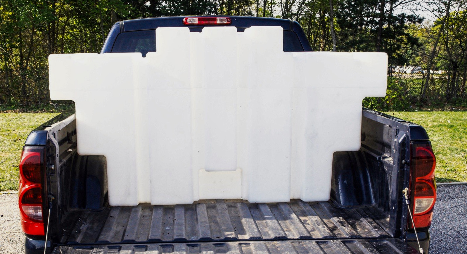 Custom Rotomolded Plastic Tank in the back of a pickup truck