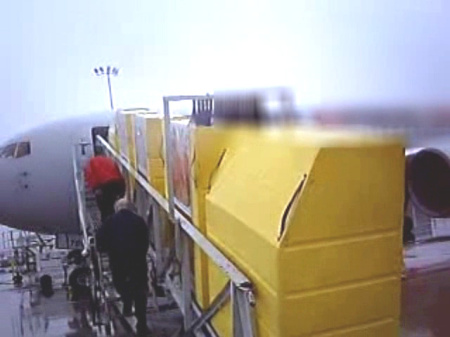 Custom Air Cargo Containers Being Loaded Onto Plane